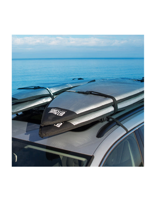 Soft Racks Double System Multiple Board Carrier for Car Roofs On Van at the Beach with Four Surfboards Loaded On Top